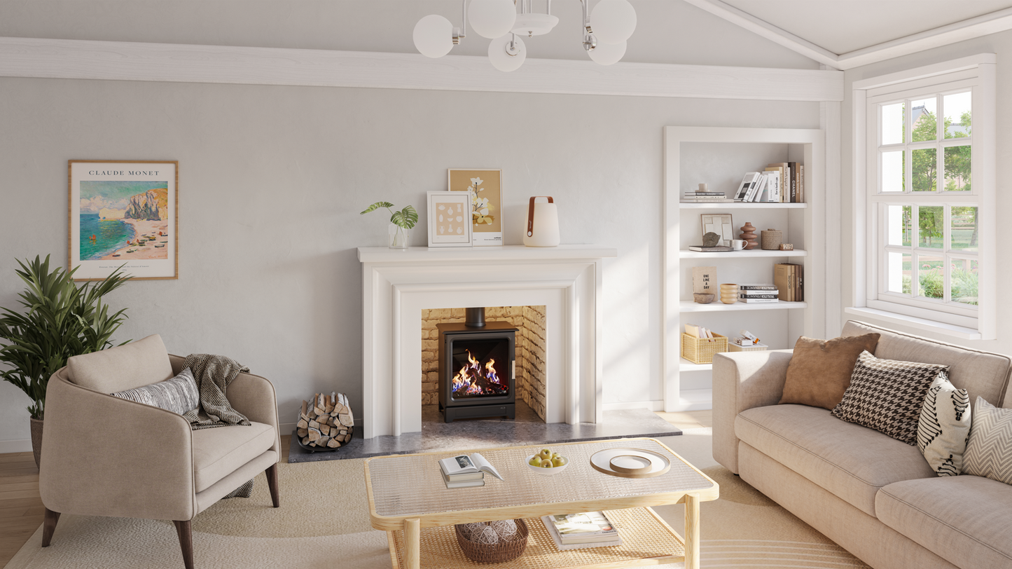 A bright, modern living room featuring a white fireplace with a brick insert, a beige armchair, a light beige sofa with patterned pillows, a wooden coffee table, and built-in white bookshelves on the right wall.