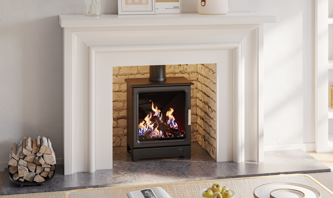 A black gas-burning fireplace insert with a visible flame, set within a white fireplace mantel and brick-lined firebox in a bright interior room.