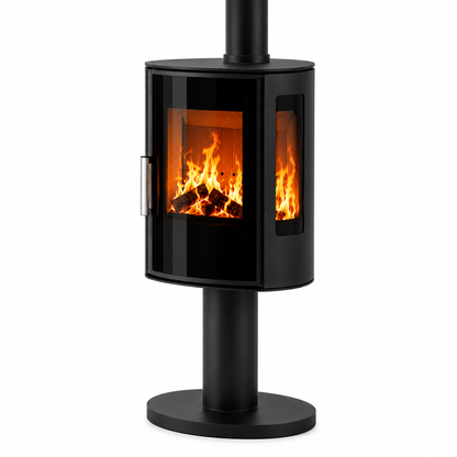 A modern black wood-burning stove with a glass door showing a glowing fire, mounted on a cylindrical stand with a circular base and a vertical chimney pipe, isolated on a white background.