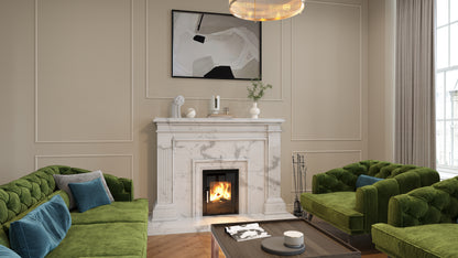 ACR T400 ECO Black Glass. A styled living room featuring a white marble fireplace with a lit fire, flanked by two green velvet tufted sofas and matching armchairs with blue pillows. A dark wood coffee table sits in front, and a framed abstract print hangs on the beige panelled wall above.