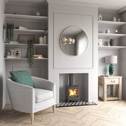 ACR Woodpecker WP4. Modern living room with a fireplace, armchair, and shelves.