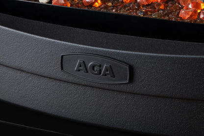 Close-up of a black appliance with 'AGA' branding, featuring glowing red and orange stones in the background.