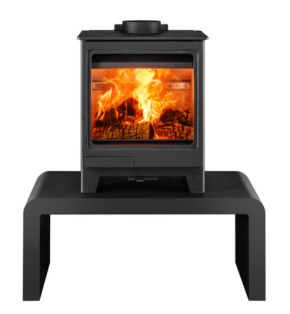 A black wood-burning stove with a glass front door showing a bright orange fire, set on a matching black metal stand against a plain white background.