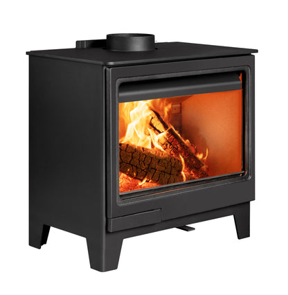 A black wood-burning stove side angle with a glass front door showing a bright fire and logs, isolated on a white background.