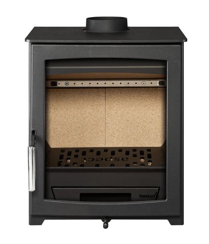 A black cast iron wood stove with a glass door, showing a beige ceramic liner inside, a metal grate, and a silver lever handle on the left side.