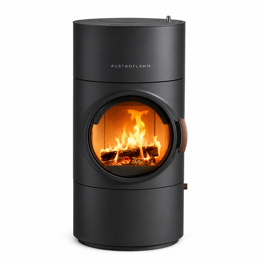 Austroflamm cylindrical wood-burning stove with a matte black finish, featuring a circular glass front door showing a burning fire, on a solid white background.