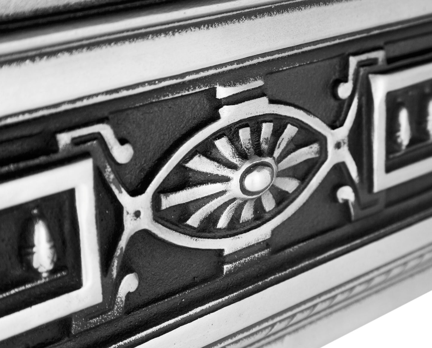 Carron Fireplace Close-up of a decorative metal vent with intricate design