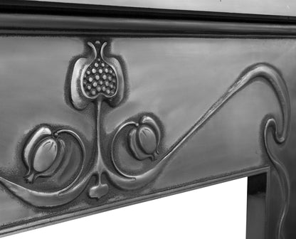 Carron Fireplace Decorative metal mantel with intricate designs on a white background