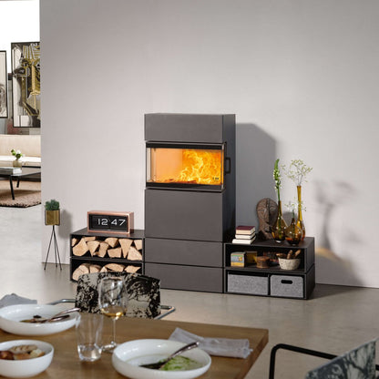 Modern living room with a gray fireplace and decorative items.