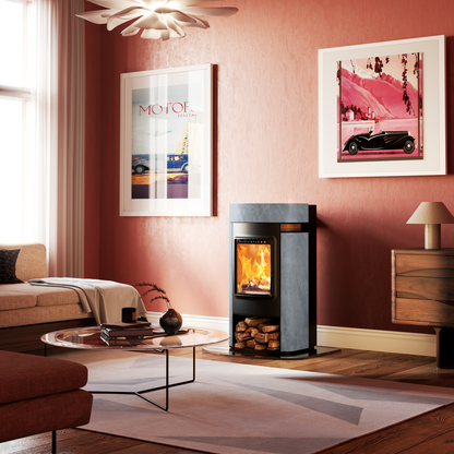 Modern living room with a wood-burning stove, framed pictures on the wall, and a sofa.