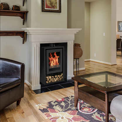 Living room with a Explorer 5F Stove with Log store, brown leather chair, and wooden coffee table.