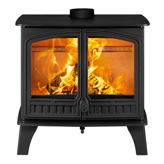 A black cast iron wood-burning stove with two glass doors showing a bright orange and yellow fire inside, isolated on a white background.