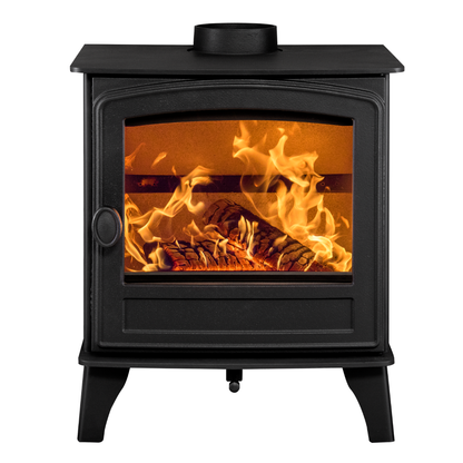 A black metal wood-burning stove with a glass front door showing a burning fire and logs inside, photographed on a plain white background.