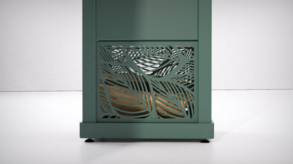 A modern spruce green outdoor stove log storage with a decorative leaf-patterned laser-cut front panel, shown against a clean white studio background.