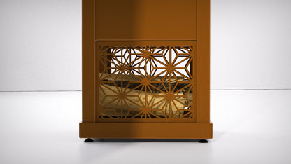 A modern rust brown outdoor stove log storage with a decorative leaf-patterned laser-cut front panel, shown against a clean white studio background.