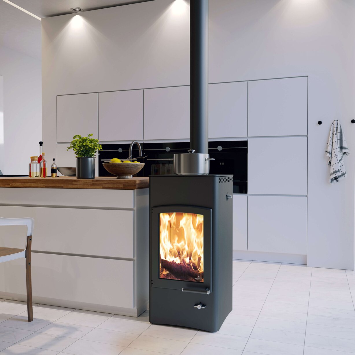 A modern black wood-burning stove with an active fire visible through the front glass door, positioned in a contemporary kitchen with light gray cabinets and a tiled floor.