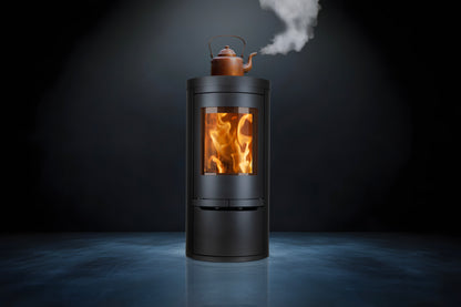 Opus Aria Wood-burning stove with a copper kettle on top, emitting steam against a dark background.