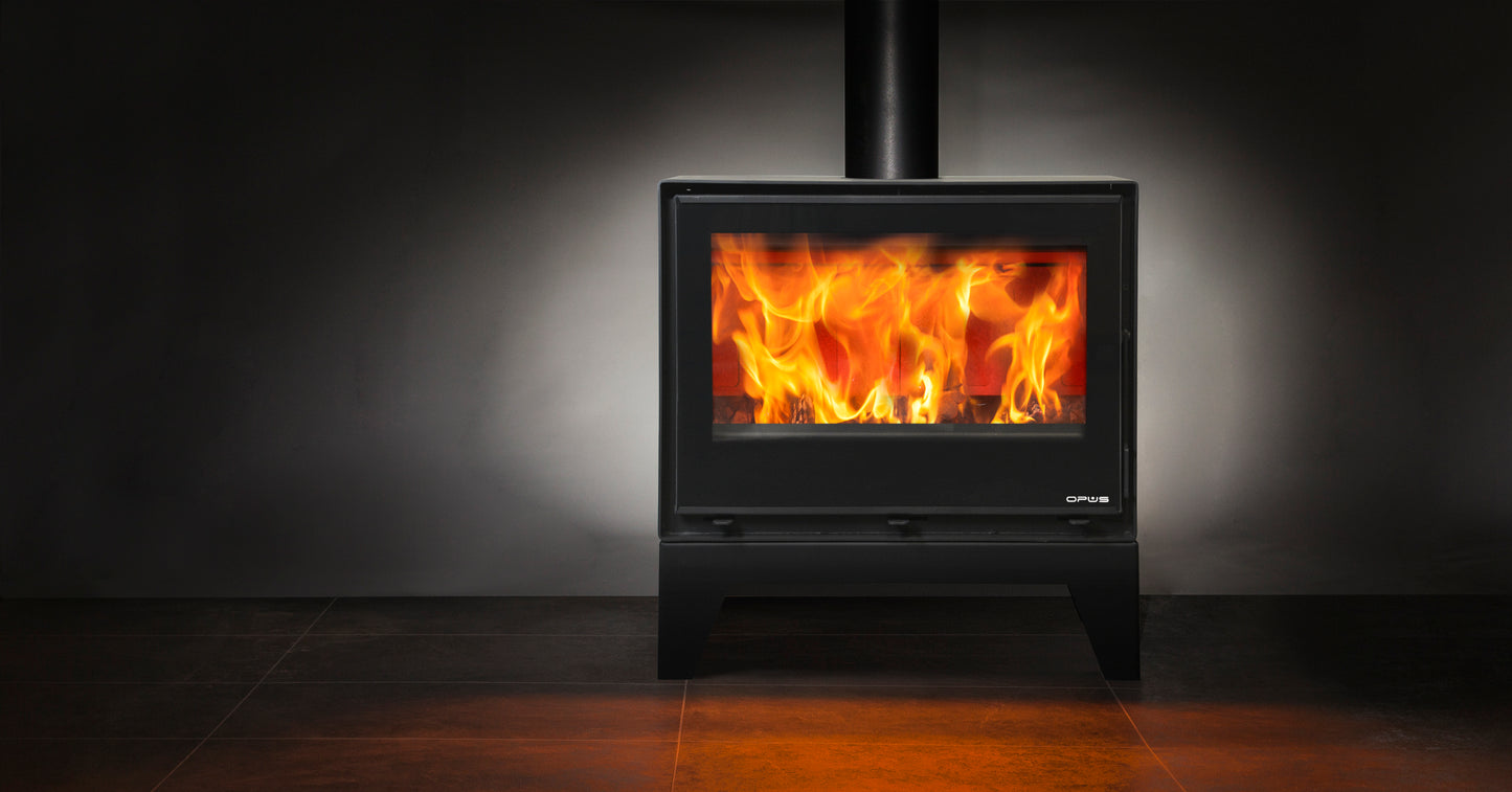 Opus Octave stove with flames inside on a dark background