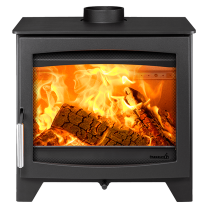 A black wood-burning stove with a glass front door showing bright orange flames and logs, isolated on a white background.