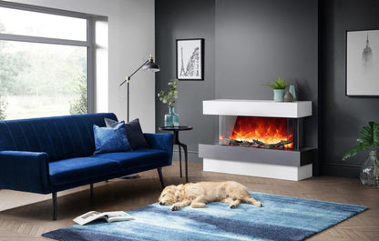 Rayburn Stratus 100-39 Tru View Electric Fire. White surround, blue sofa and dog on blue rug