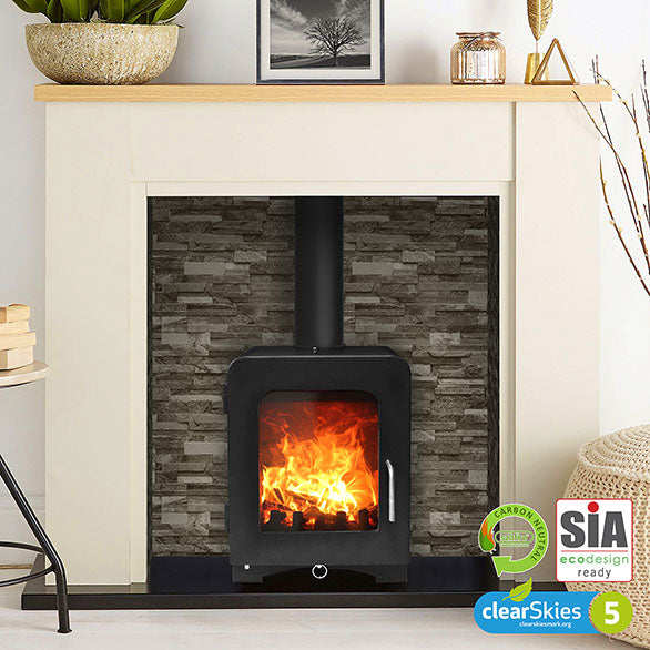 Saltfire ST2 Log Burning Stove with lit fire, decorative mantel, and SIA logo.
