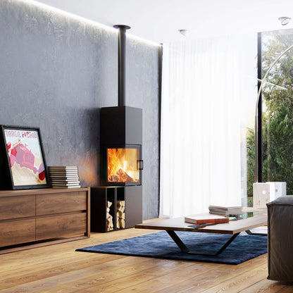 A modern black wood-burning fireplace with a visible fire, set in a contemporary living room with a gray textured wall, wooden floor, and a blue rug.