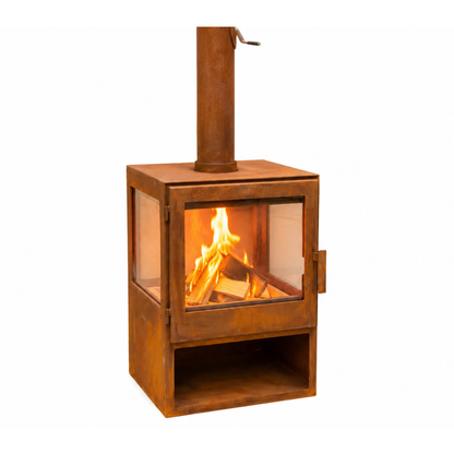 A square metal wood-burning stove with a rusted steel finish, featuring a glass front door showing a burning fire, a tall chimney pipe, and an open lower shelf, isolated on a white background.